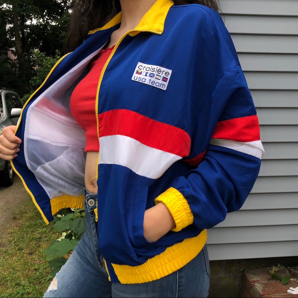Yellow, blue, red, and white bomber jacket.